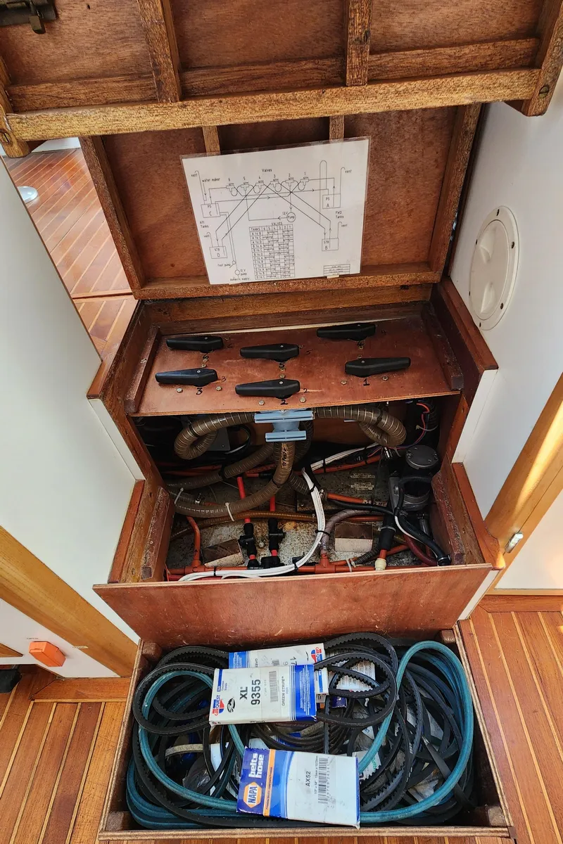 Slide: The Image of Engine compartment of 2004 Dudley Dix Jacobs Bros 43 Pilot with belts and wiring. - 49