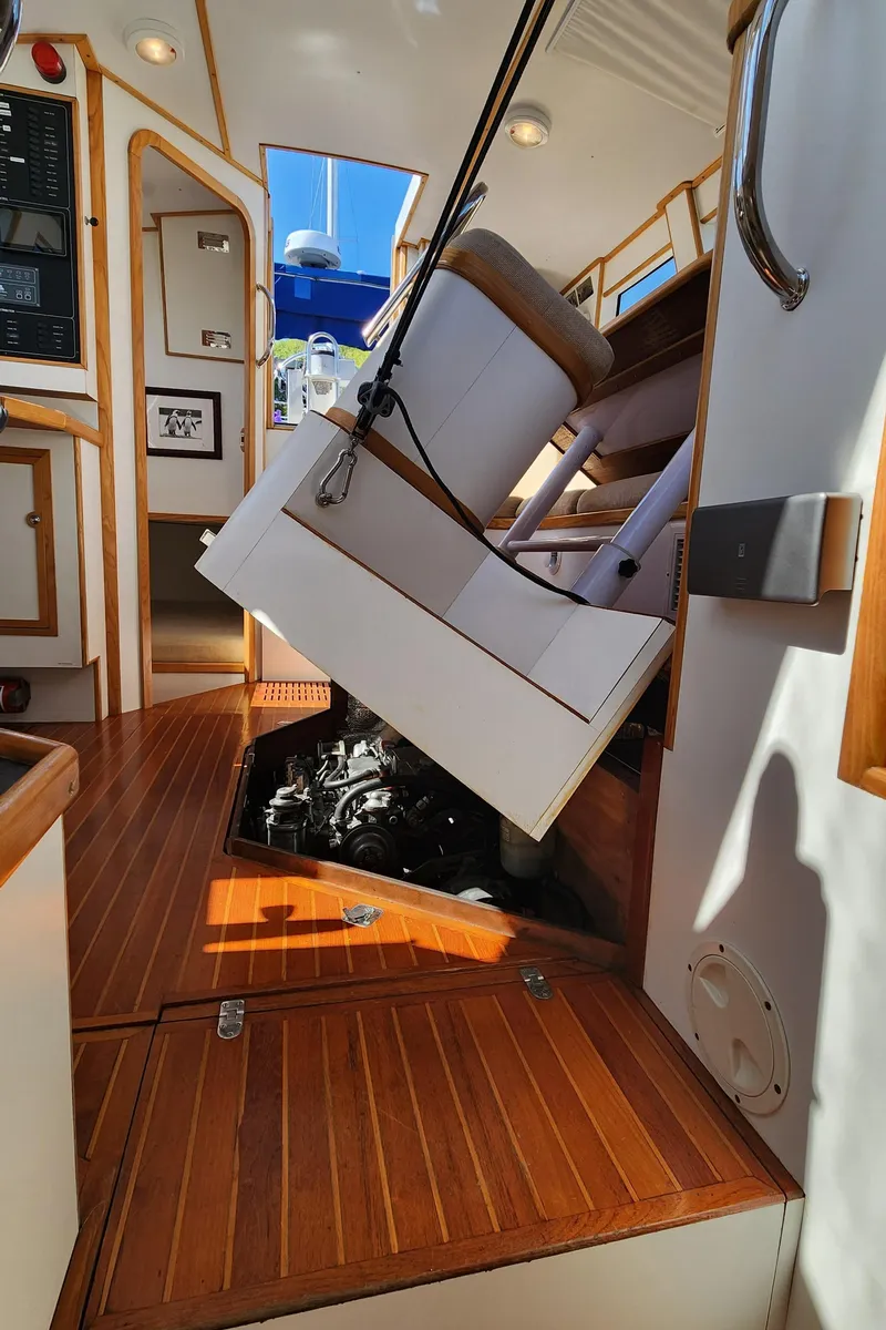 Slide: The Image of 2004 Dudley Dix Jacobs Bros 43 Pilot interior with engine access and wooden flooring. - 39