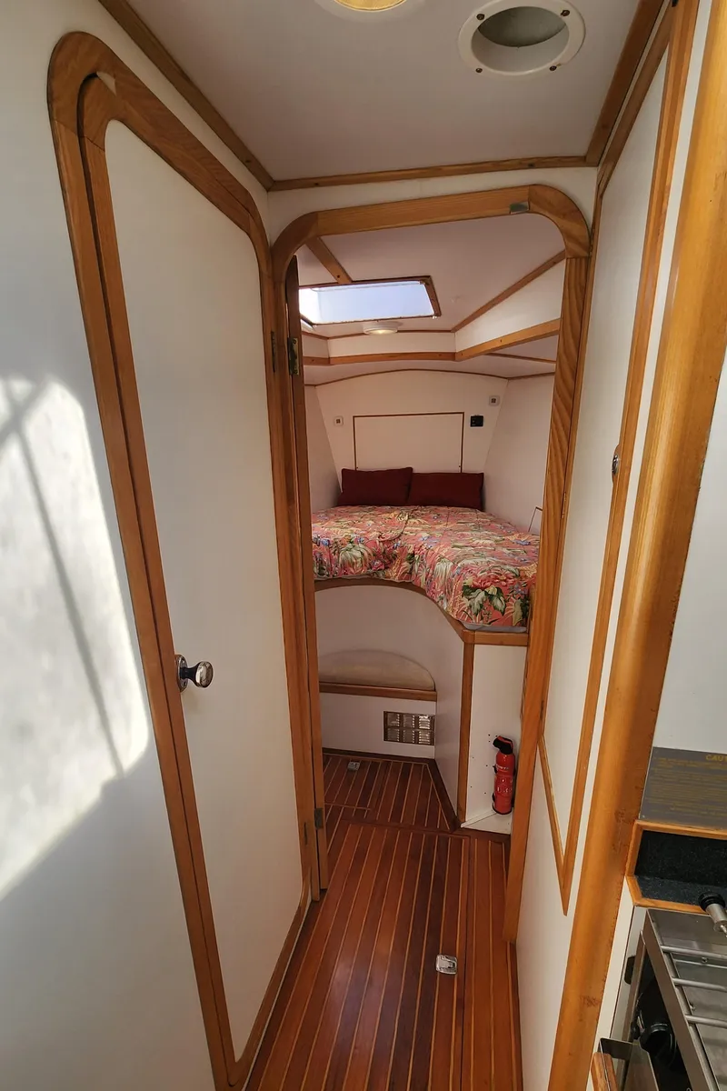 Slide: The Image of Cozy cabin interior of 2004 Dudley Dix Jacobs Bros 43 Pilot sailboat with wood accents. - 40
