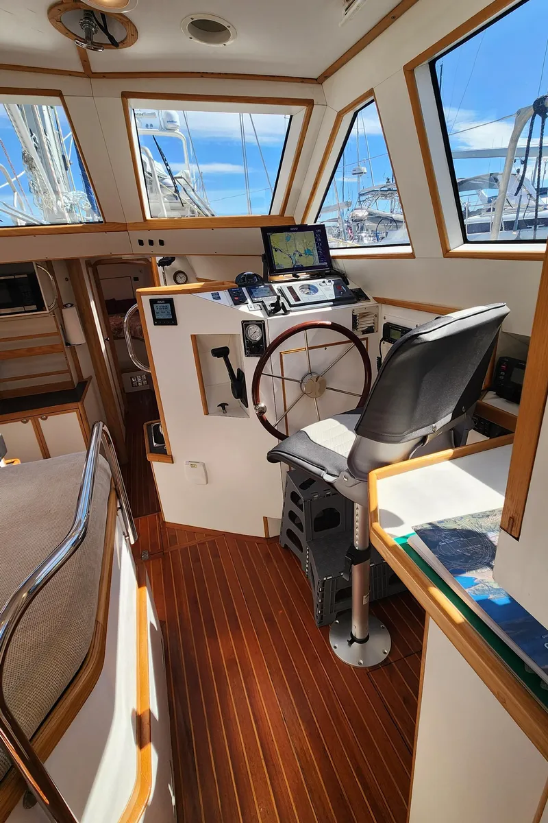 Slide: The Image of 2004 Dudley Dix Jacobs Bros 43 Pilot boat interior with navigation equipment and wooden flooring. - 25