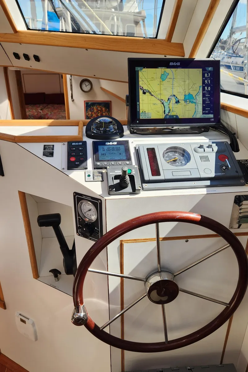 Slide: The Image of Helm of 2004 Dudley Dix Jacobs Bros 43 Pilot with navigation equipment and wooden steering wheel. - 28