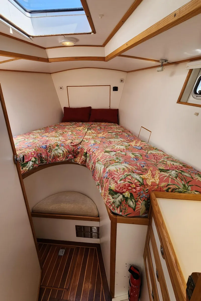 Slide: The Image of Cozy cabin interior of 2004 Dudley Dix Jacobs Bros 43 Pilot with floral bedding. - 46
