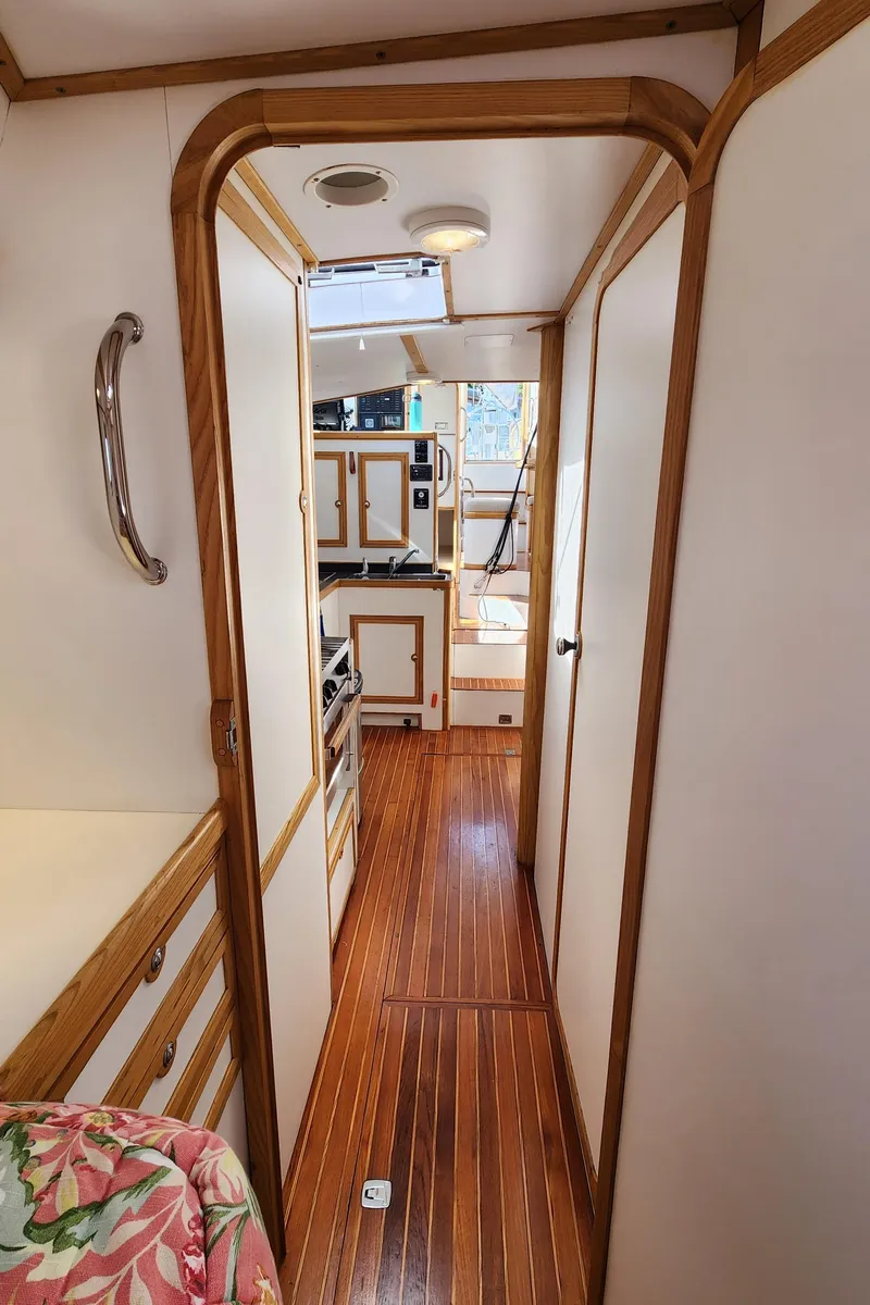 Slide: The Image of Interior of 2004 Dudley Dix Jacobs Bros 43 Pilot yacht with wooden flooring and cabinetry. - 47