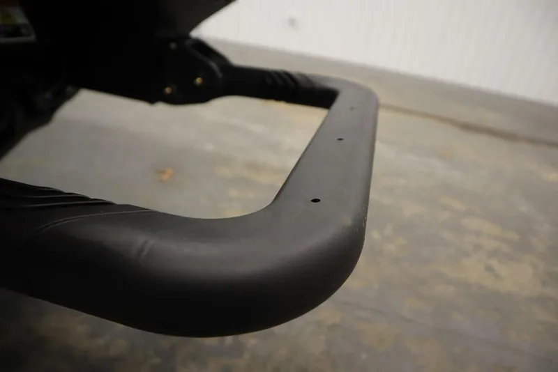 Slide: The Image of Close-up of 2026 Sea-Doo Explorer Pro 170 handlebar in a garage setting. - 25