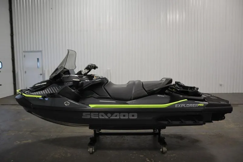 Slide: The Image of 2026 Sea-Doo Explorer Pro 170 jet ski in a showroom setting. - 7