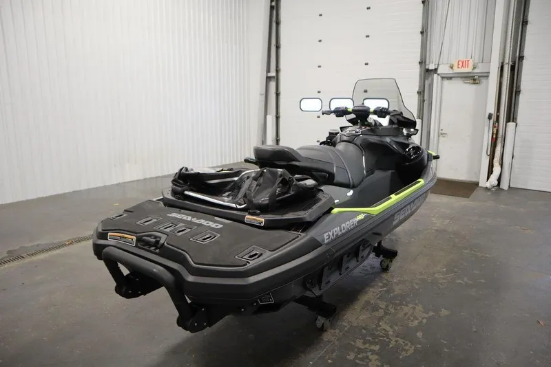Slide: The Image of 2026 Sea-Doo Explorer Pro 170 jet ski in a garage setting. - 8
