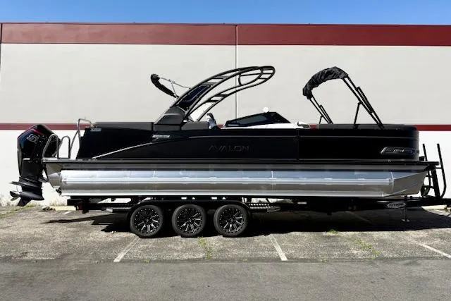The Image of 2026 Avalon Catalina Quad Lounge 27' pontoon boat, black exterior, parked on a trailer. - 0
