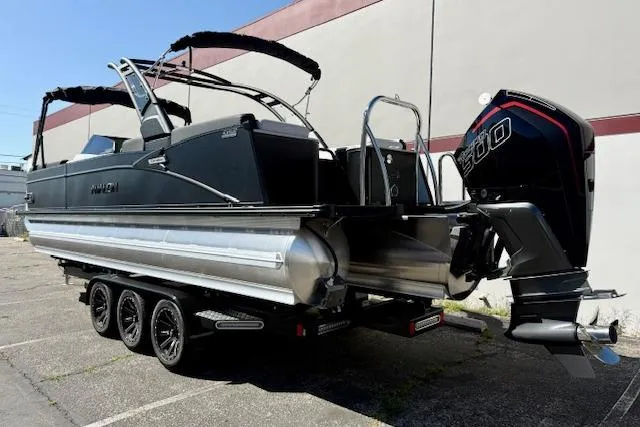 Slide: The Image of 2026 Avalon Catalina Quad Lounge 27' pontoon boat with powerful outboard motor. - 15
