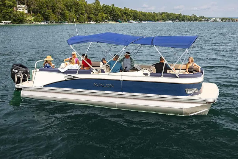 Slide: The Image of Manufacturer Provided Image: 2026 Avalon Geofish RF pontoon boat cruising on a scenic lake with passengers. - 19