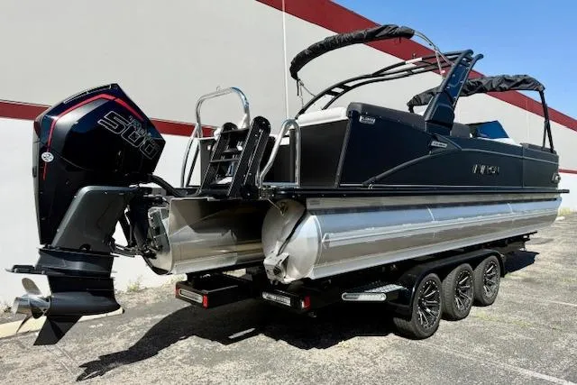 Slide: The Image of 2026 Avalon Catalina Quad Lounge 27' pontoon boat with powerful outboard motor. - 3