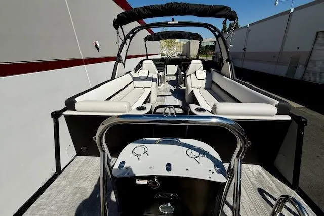 Slide: The Image of 2026 Avalon Catalina Quad Lounge 27' pontoon boat with spacious seating and modern design. - 8