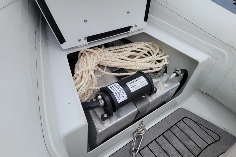 Slide: The Image of Storage compartment of 2023 Highfield Sport 330 boat with rope and equipment. - 10