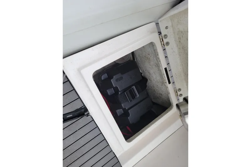 Slide: The Image of Battery compartment of 2023 Highfield Sport 330 boat, featuring secure storage. - 11