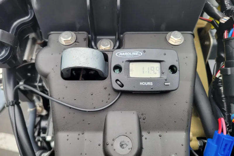 Slide: The Image of Hour meter on 2023 Highfield Sport 330 engine, displaying 11.9 hours. - 14