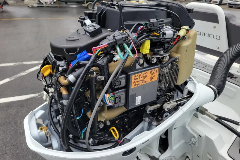 Slide: The Image of 2023 Highfield Sport 330 engine with visible wiring and components. - 15