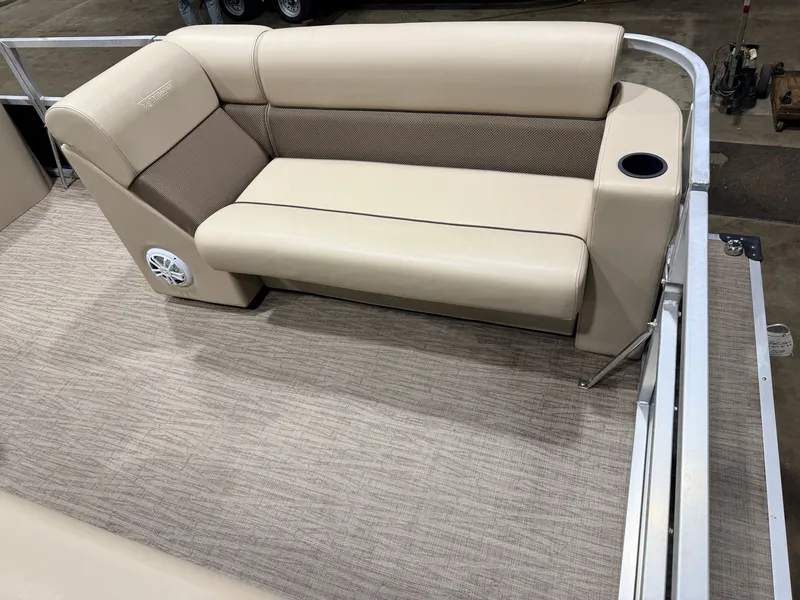 Slide: The Image of Interior of Northstar 2200 Cruise Pontoon 2023 with beige seating area. - 10