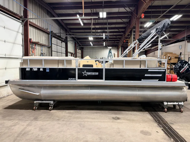 Slide: The Image of 2023 Northstar 2200 Cruise Pontoon in storage facility. - 37
