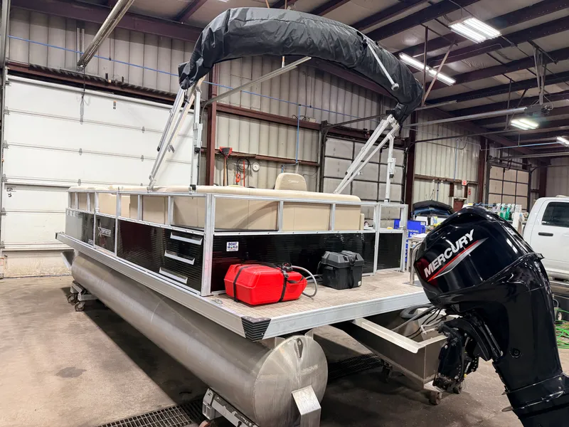 Slide: The Image of 2023 Northstar 2200 Cruise Pontoon in warehouse with Mercury engine. - 40