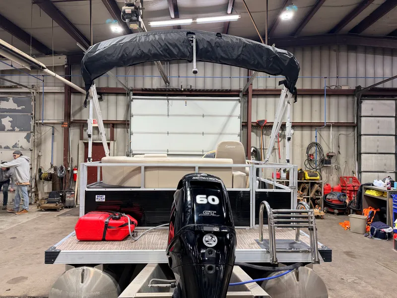 Slide: The Image of 2023 Northstar 2200 Cruise Pontoon in warehouse with motor. - 41