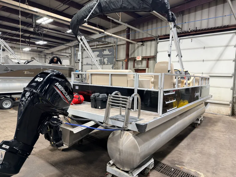 Slide: The Image of 2023 Northstar 2200 Cruise Pontoon in warehouse with Mercury engine. - 42