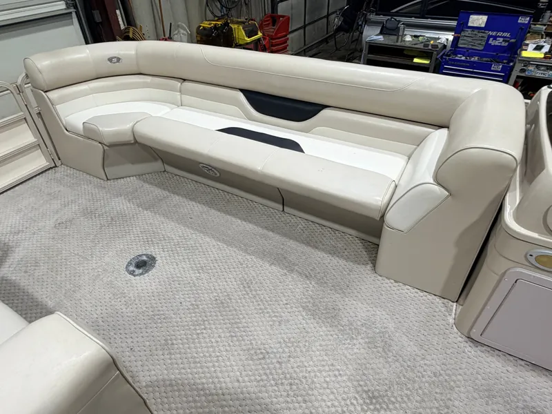 Slide: The Image of Interior of a 2006 Smoker Craft 8522 Cruise Pontoon with beige seating area. - 15
