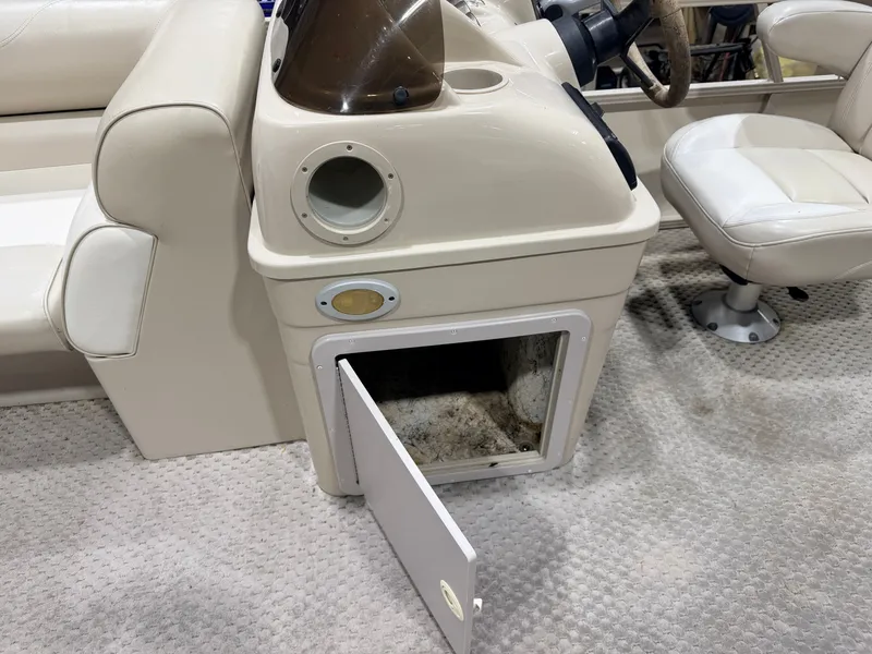 Slide: The Image of Interior of 2006 Smoker Craft 8522 pontoon boat with open storage compartment. - 20