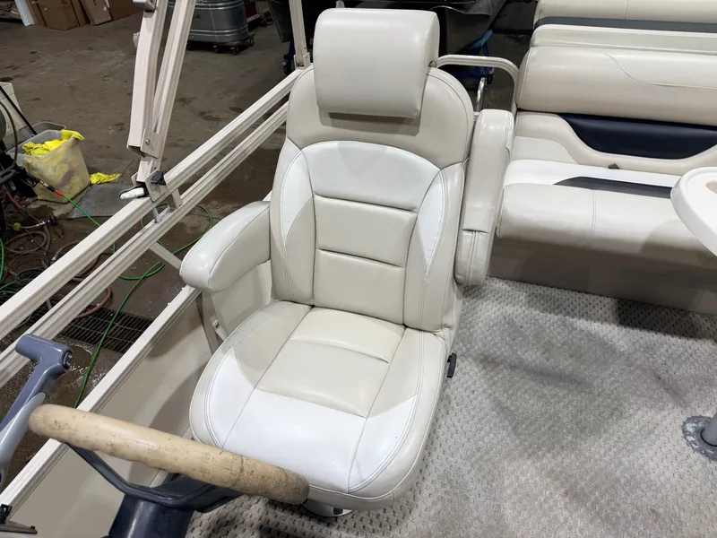 Slide: The Image of 2006 Smoker Craft pontoon boat seat and helm, interior view. - 21