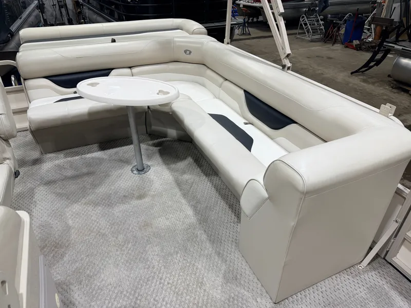 Slide: The Image of Interior of a 2006 Smoker Craft 8522 pontoon boat with table. - 27
