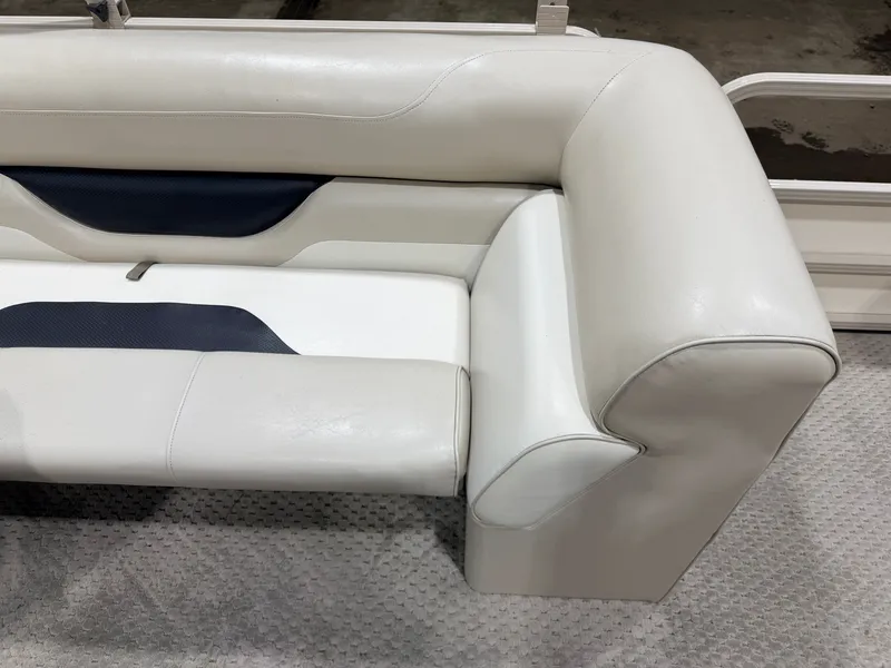 Slide: The Image of 2006 Smoker Craft pontoon seating, cream leather upholstery. - 30