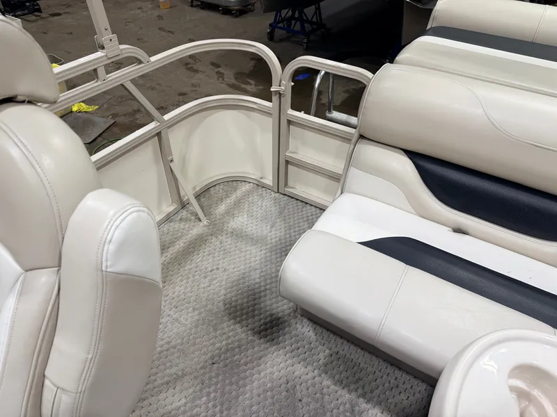 Slide: The Image of Interior of 2006 Smoker Craft 8522 pontoon boat with white seating. - 33