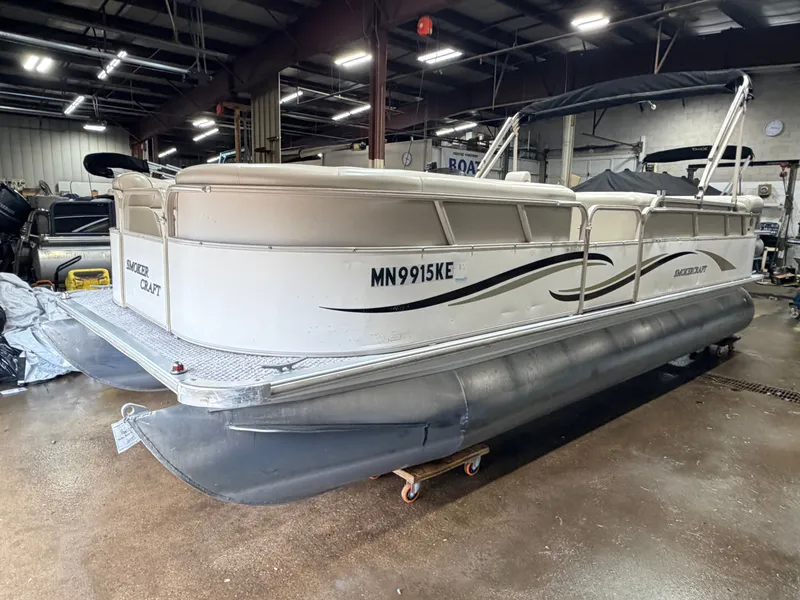 Slide: The Image of 2006 Smoker Craft pontoon boat with Yamaha 60HP 4-stroke engine in warehouse. - 37