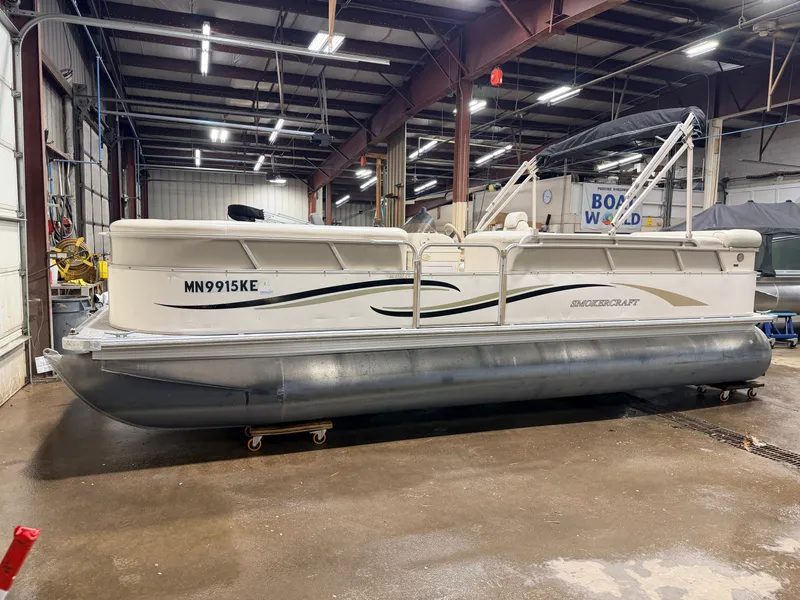 Slide: The Image of 2006 Smoker Craft 8522 pontoon with Yamaha 60HP 4-stroke indoors. - 38