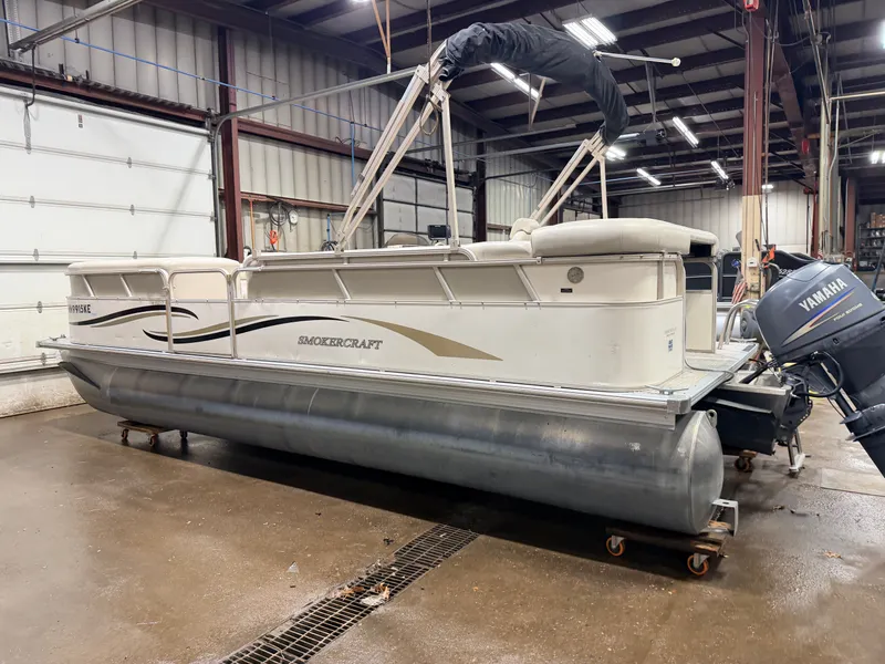 Slide: The Image of 2006 Smoker Craft pontoon with Yamaha 60HP 4-stroke engine in warehouse. - 40