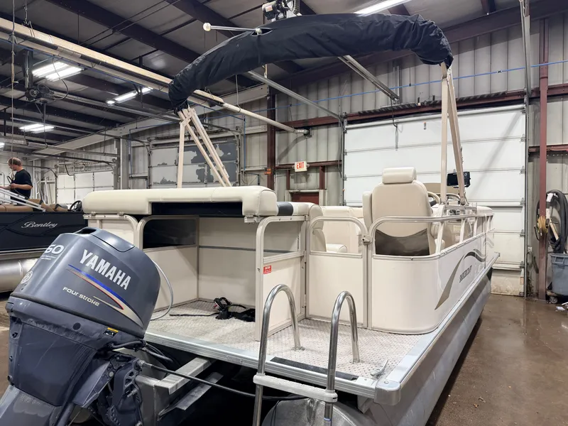 Slide: The Image of 2006 Smoker Craft pontoon with Yamaha 60HP 4-stroke engine in warehouse. - 42