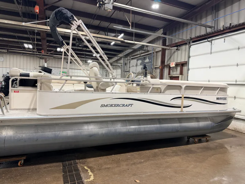 Slide: The Image of 2006 Smoker Craft 8522 pontoon with Yamaha 60HP 4-stroke indoors. - 45