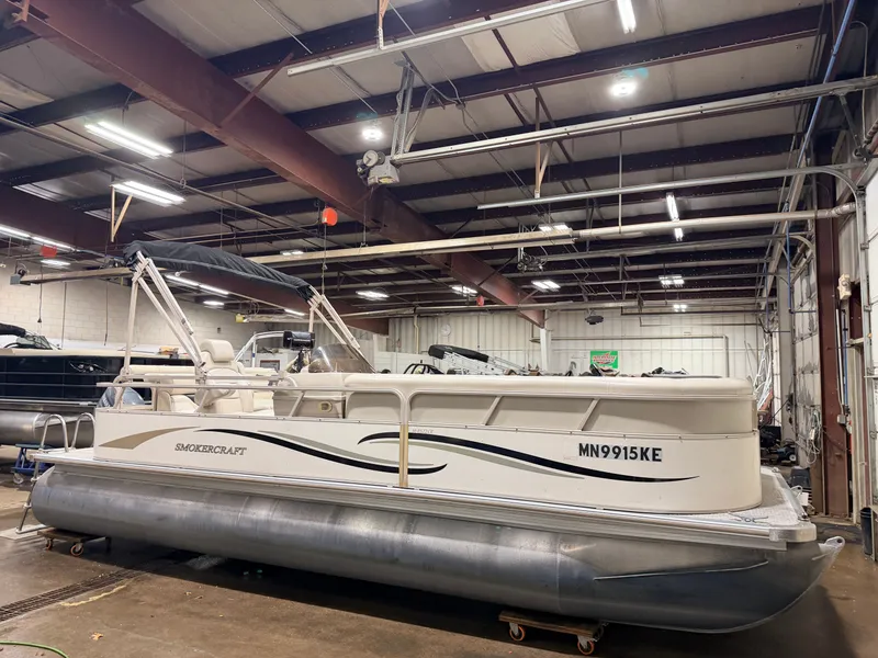 Slide: The Image of 2006 Smoker Craft pontoon boat in warehouse, 60HP Yamaha engine. - 46