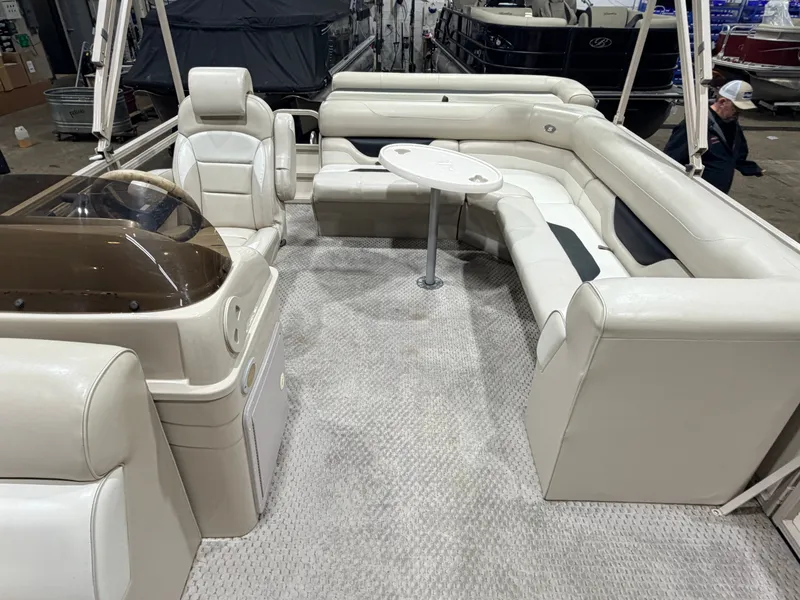 Slide: The Image of 2006 Smoker Craft pontoon with beige interior and table. - 6