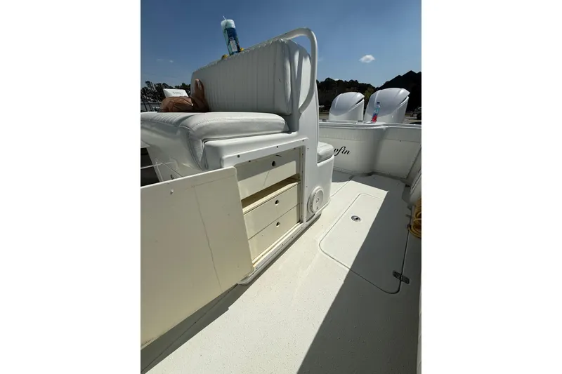 Slide: The Image of 2013 Yellowfin 32 Offshore boat interior with storage compartments and seating. - 10