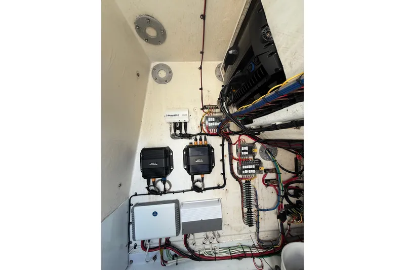 Slide: The Image of 2013 Yellowfin 32 Offshore boat interior with seating and storage compartments. - 11