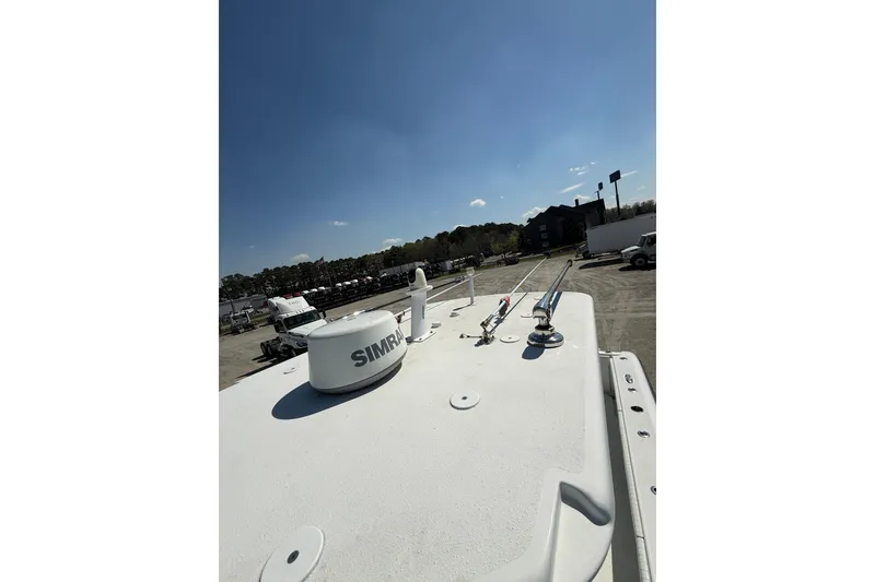 Slide: The Image of 2013 Yellowfin 32 Offshore boat interior with seating and control panel. - 17