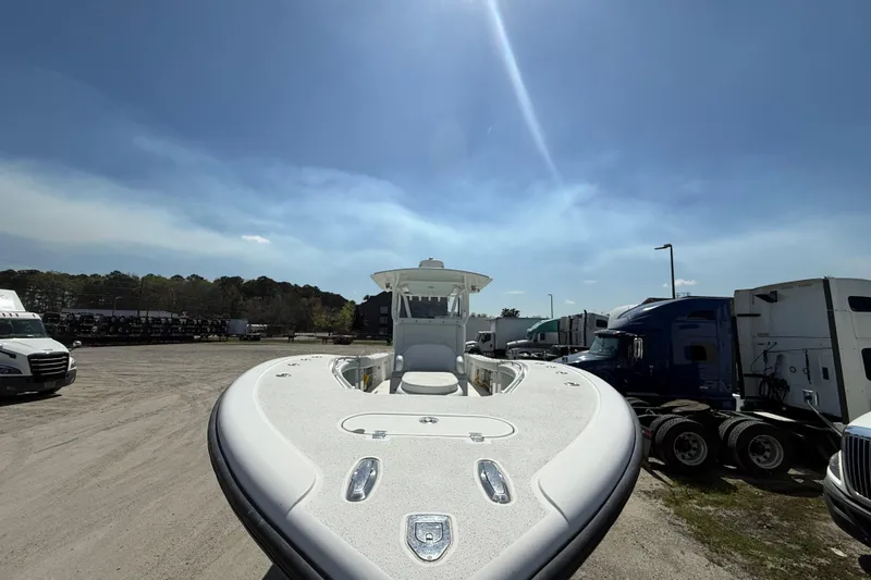 Slide: The Image of 2013 Yellowfin 32 Offshore boat interior with seating and storage compartments. - 19