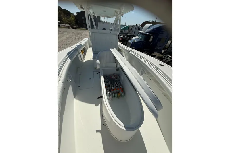 Slide: The Image of 2013 Yellowfin 32 Offshore boat dashboard with steering wheel and navigation equipment. - 21