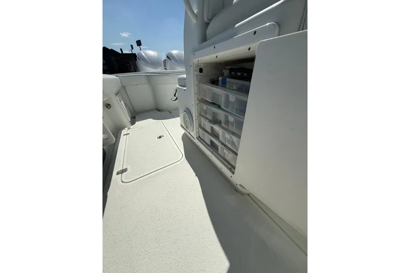 Slide: The Image of 2013 Yellowfin 32 Offshore boat dashboard with steering wheel and navigation screens. - 9