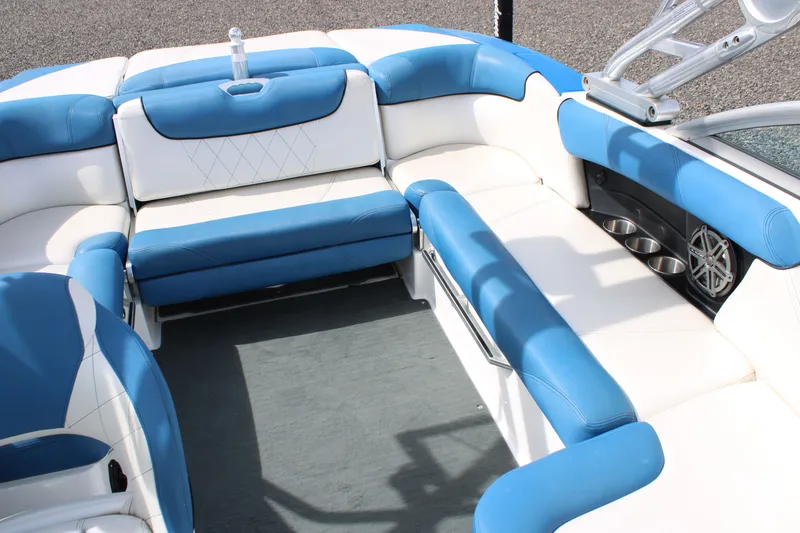 Slide: The Image of Interior of a 2013 MasterCraft X10 boat with blue and white seating. - 10