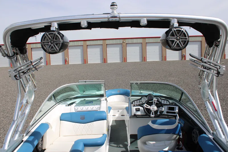 Slide: The Image of Interior view of a 2013 MasterCraft X10 boat with blue and white seating. - 11