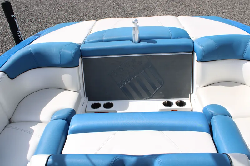 Slide: The Image of Interior of a 2013 MasterCraft X10 boat with blue and white seating. - 15