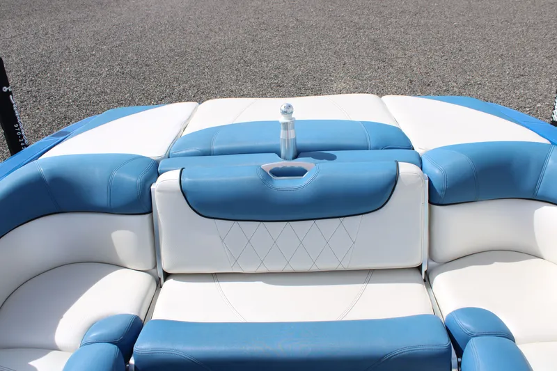 Slide: The Image of Interior of a 2013 MasterCraft X10 boat with blue and white seating. - 7
