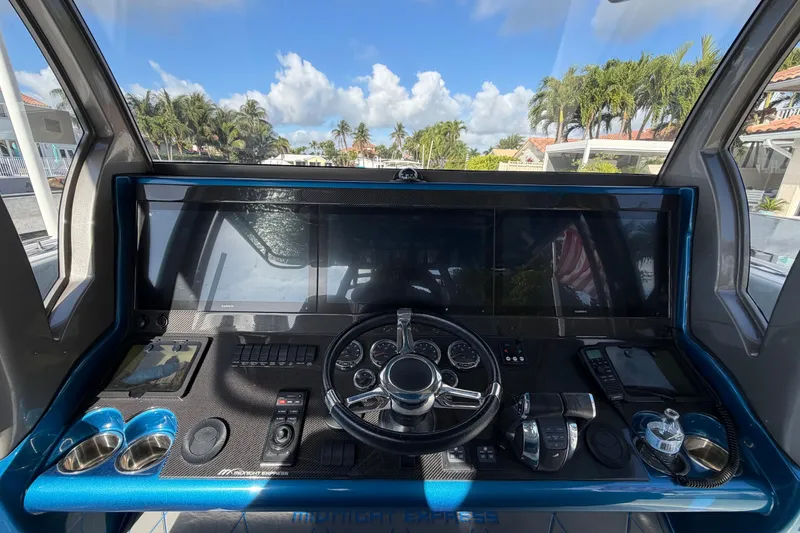 Slide: The Image of Helm of Midnight Express 43 Open boat with modern controls and panoramic view. - 3