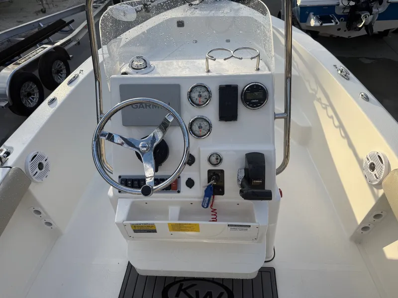 Slide: The Image of 2024 Key West 179 FS boat console with steering and instruments. - 13