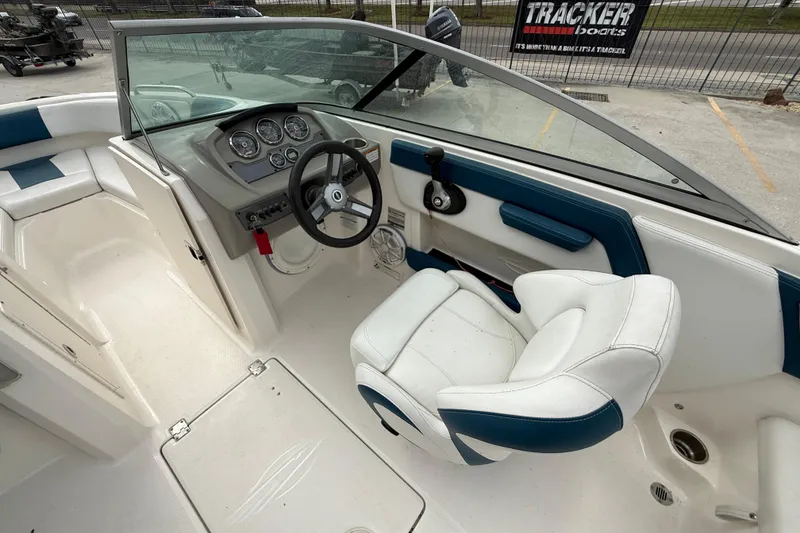 Slide: The Image of 2016 Chaparral H20 21 Deluxe boat interior with steering wheel and dashboard controls. - 11